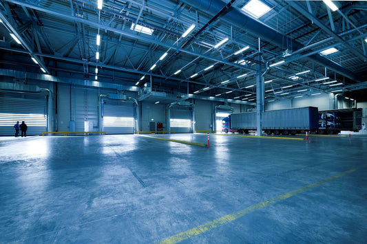 image of empty warehouse distribution centre with lorry's in a bay 